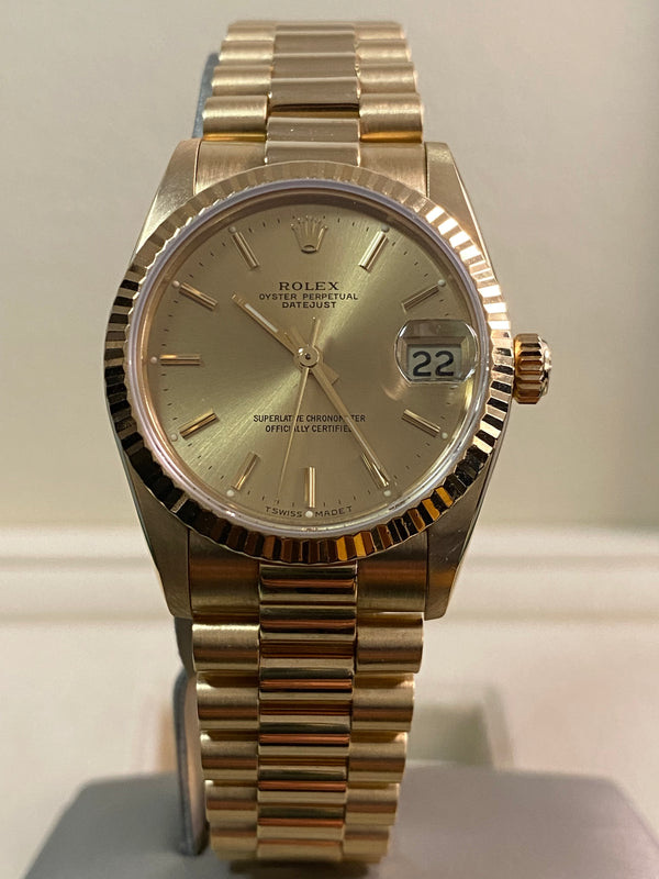Rolex Yellow Gold Datejust 31 - R serial - Fluted Bezel - Champagne Dial - President Bracelet - 68278